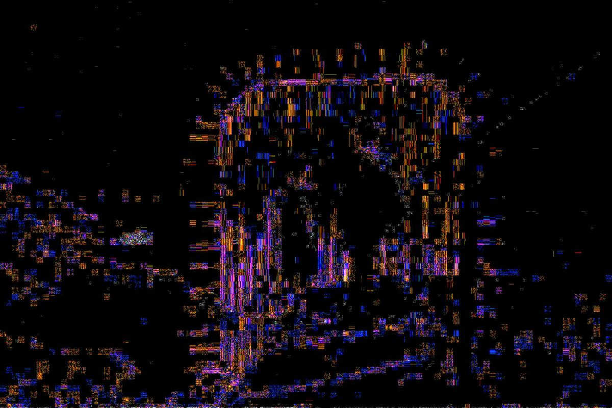 The error level analysis map of the same photo, dark overall with a bright patch where the boat was pasted